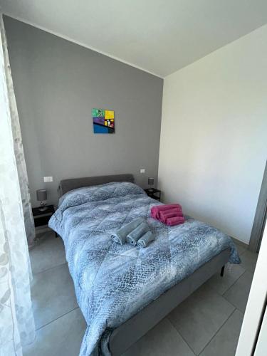 Postel nebo postele na pokoji v ubytování Casa di Nalo'