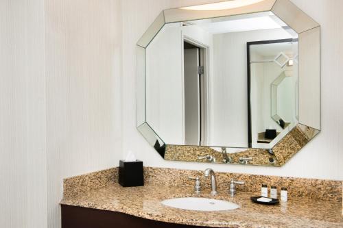 a bathroom with a sink and a mirror at Sheraton Mission Valley San Diego Hotel in San Diego