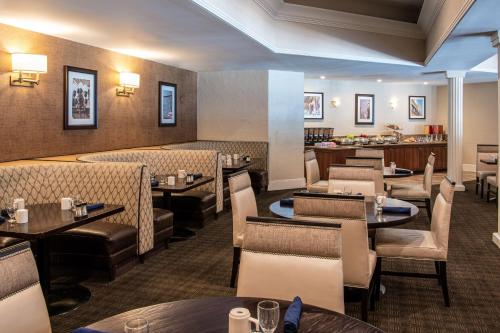 a dining room with tables and chairs and tablesktop at Sheraton Mission Valley San Diego Hotel in San Diego