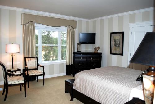 Ένα ή περισσότερα κρεβάτια σε δωμάτιο στο Summer Creek Inn