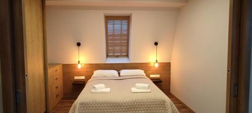 Ένα ή περισσότερα κρεβάτια σε δωμάτιο στο Senamiesčio horizontai