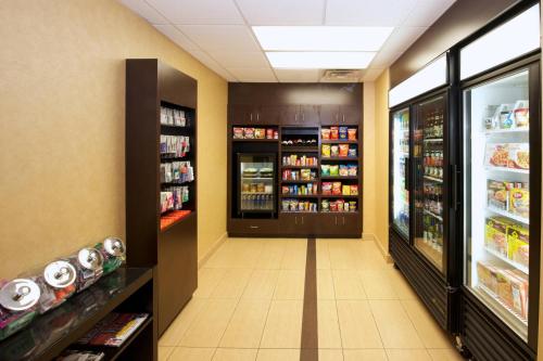 a aisle of a store with food and drinks at Residence Inn by Marriott Phoenix Airport in Phoenix