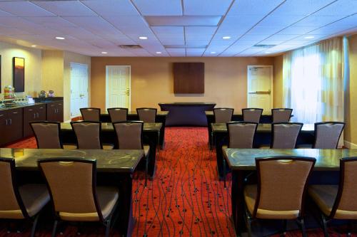 a conference room with tables and chairs in it at Residence Inn by Marriott Phoenix Airport in Phoenix