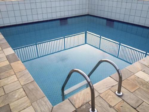 Πισίνα στο ή κοντά στο AP - 1 Dorm - Ar - Piscina - Churrasqueira - Academia - 350 metros Praia