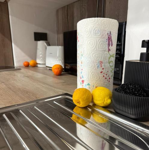 a counter with lemons and a roll of paper towels at Iconic Suites Valletta in Valletta