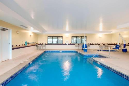 a large swimming pool with blue water at SpringHill Suites by Marriott Omaha East, Council Bluffs, IA in Council Bluffs