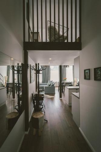 a living room with a loft bed and a kitchen at "Hunter's Suite"- at the heart of Hartberg I Parking in Hartberg