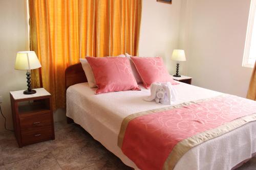 Postel nebo postele na pokoji v ubytování Hotel Del Sol Galapagos