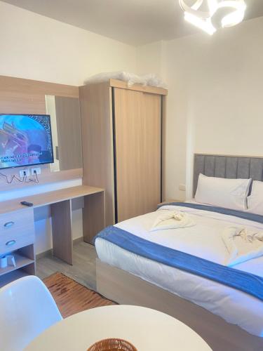 A bed or beds in a room at Imperial Resort Hurghada Studio pool view