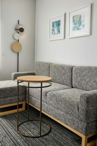 a living room with a couch and a table at TownePlace Suites by Marriott Tampa Casino Area in Tampa