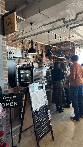 a group of people standing inside of a bakery at Eastern sunrise home Valuable historical Japanese-style exclusive 4mins to ocean in Choshi