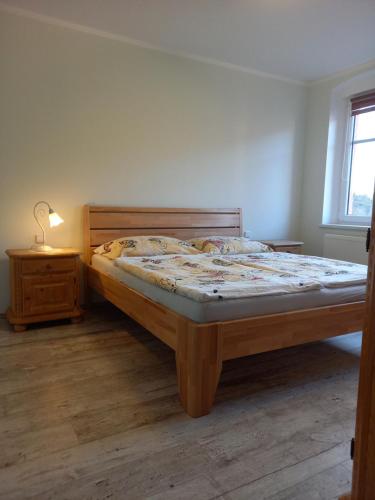 Postel nebo postele na pokoji v ubytování Apartmány Marie Jáchymov