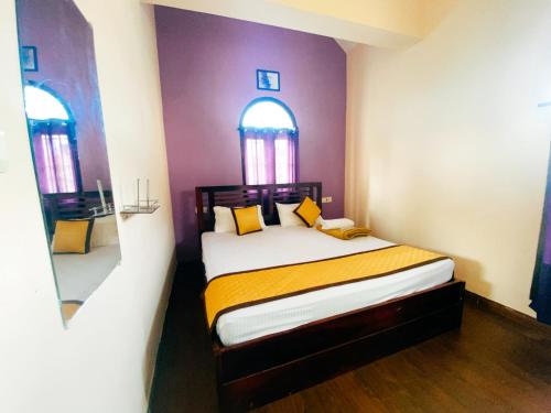 Ένα ή περισσότερα κρεβάτια σε δωμάτιο στο Hilltown Villa Holiday's