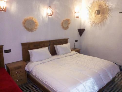 Postel nebo postele na pokoji v ubytování Riad Dar belghiti