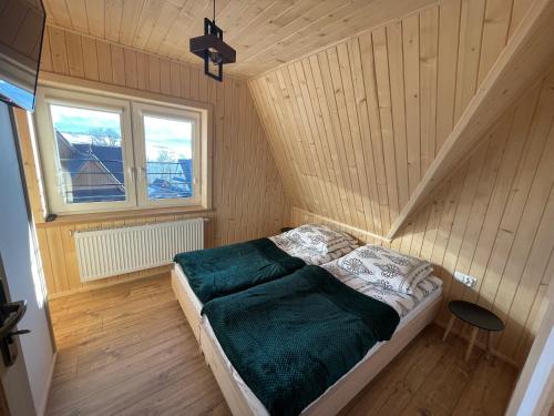 Postel nebo postele na pokoji v ubytování Apartament Maryna Pokoje Baciary