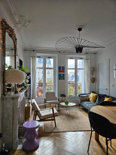 a living room with a couch and a table at Cosy private room in Shared appartment - 1 person only ! in Paris