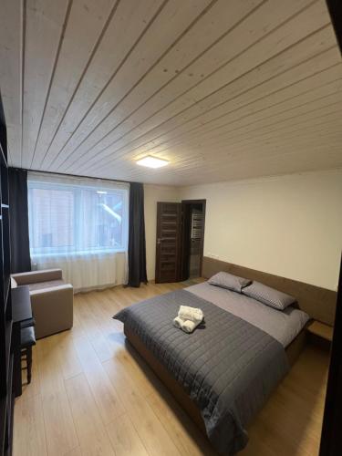 Postel nebo postele na pokoji v ubytování U Stozi Hotel