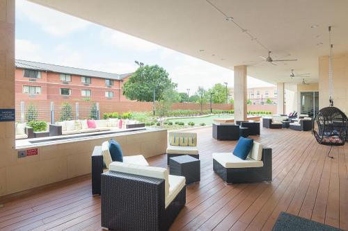a lobby with couches and chairs in a building at SpringHill Suites by Marriott Fort Worth Fossil Creek in Fort Worth