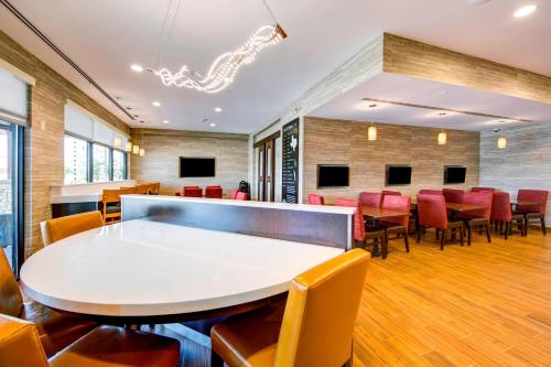 a room with a ping pong table and chairs at TownePlace Suites by Marriott Big Spring in Big Spring
