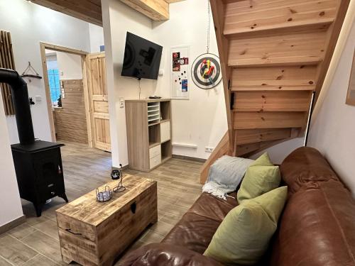 a living room with a couch and a wood stove at Haus Treibsel in Dagebüll