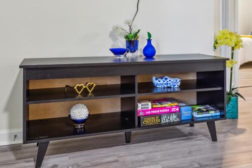 a black entertainment center in a living room at The Modern Recharging Station in Marietta