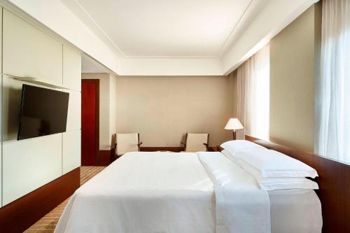 Postel nebo postele na pokoji v ubytování Sheraton São Paulo WTC Hotel