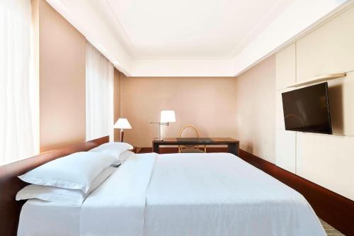 Postel nebo postele na pokoji v ubytování Sheraton São Paulo WTC Hotel