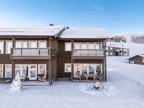 a house in the snow with snow at Leilighet på Bualie, Golsfjellet in Gol