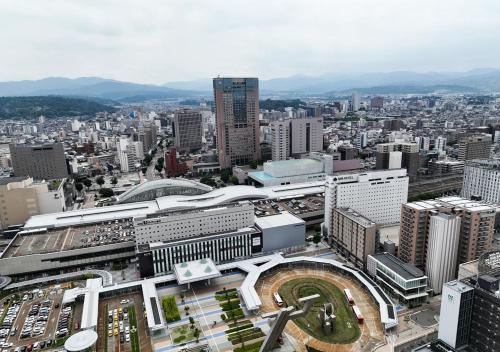 an aerial view of a city with buildings at APA Hotel Kanazawa Ekimae in Kanazawa