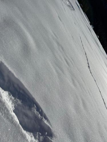 a mound of snow with a shadow on the side of it at Apartment in Austria in Pfunds