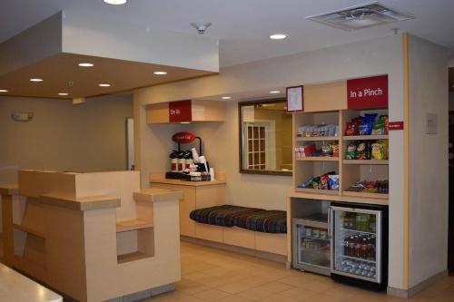 a store with a drink counter in a store at TownePlace Suites Republic Airport Long Island Farmingdale in Farmingdale