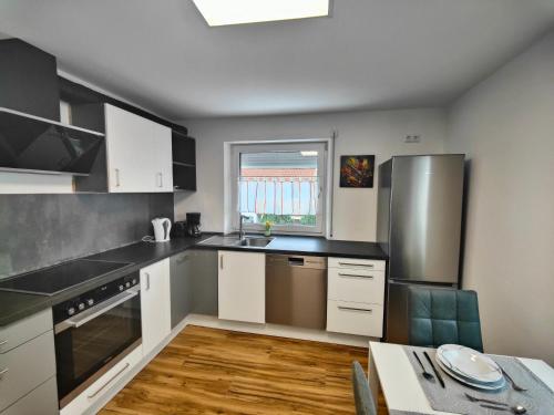 Kuchyň nebo kuchyňský kout v ubytování Monteurwohnung Sailor 13