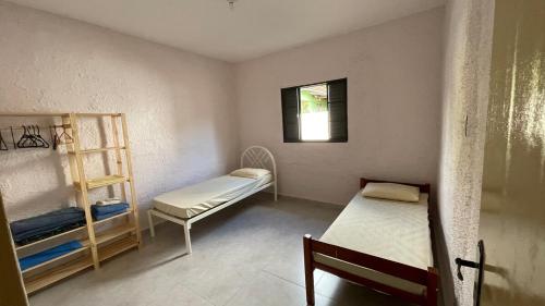 Ένα ή περισσότερα κρεβάτια σε δωμάτιο στο Casa de 3 quartos ao lado do Inatel