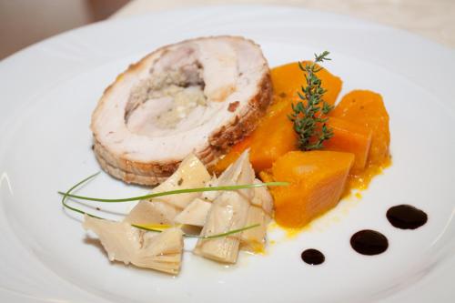 a plate of food with meat and vegetables on it at Park Hotel Italia in Tezze sul Brenta