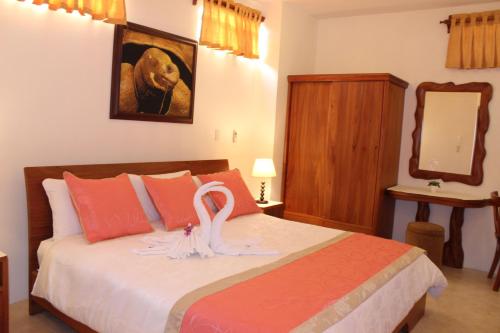 Postel nebo postele na pokoji v ubytování Hotel Del Sol Galapagos