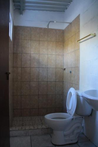 a bathroom with a toilet and a sink at Casa Campo Loma Larga in La Palma