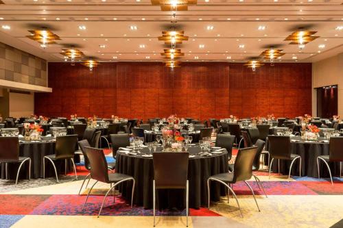 a large banquet hall with tables and chairs at The Westin Cape Town in Cape Town
