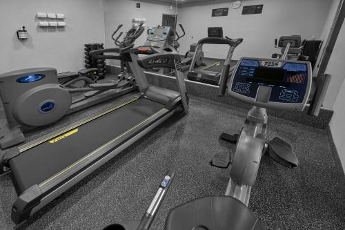 a gym with two tread machines and a treadmill at City Express by Marriott Torreon in Torreón