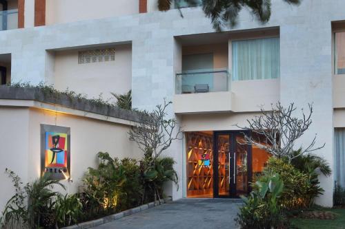 a facade of a building with doors and plants at The Westin Resort Nusa Dua, Bali in Nusa Dua