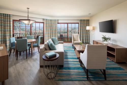 a living room with a couch and a dining room at The Westin Carlsbad Resort & Spa in Carlsbad