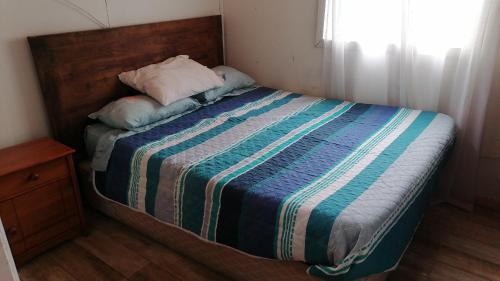 Ein Bett oder Betten in einem Zimmer der Unterkunft Cabaña Bungalow SPA pasaje Las Pataguas