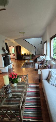 a living room with a couch and a table at Centro Paulus in Sao Paulo