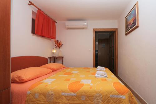 Katil atau katil-katil dalam bilik di Apartments Andrijašević