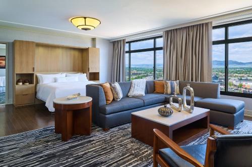 a hotel room with a bed and a couch at The Westin Westminster in Westminster