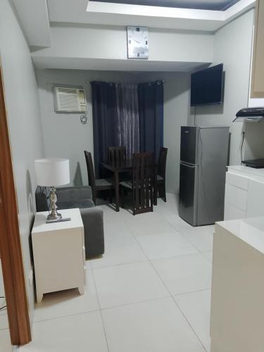a living room with a couch and a table at Roxas Blvd Stunning Studio Condo Near US Embassy in Manila