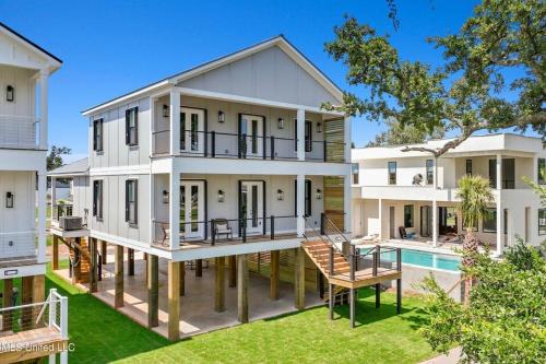 an exterior view of a house with a pool at Beach Retreat in Gulfport
