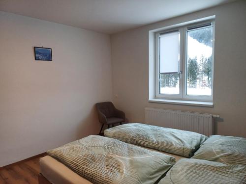 Postel nebo postele na pokoji v ubytování Appartements Dorner, Semmering