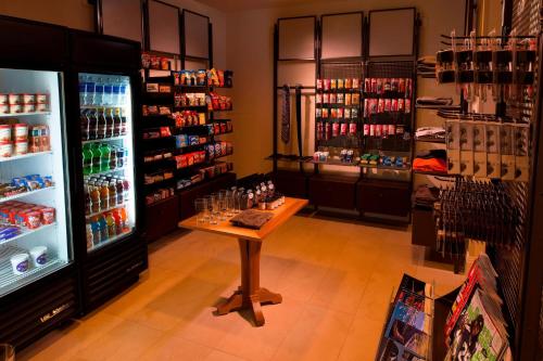 a store with a table in front of a refrigerator at Milwaukee Marriott Downtown in Milwaukee