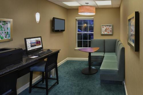 a waiting room with a computer and a desk at Residence Inn Mystic Groton in Mystic
