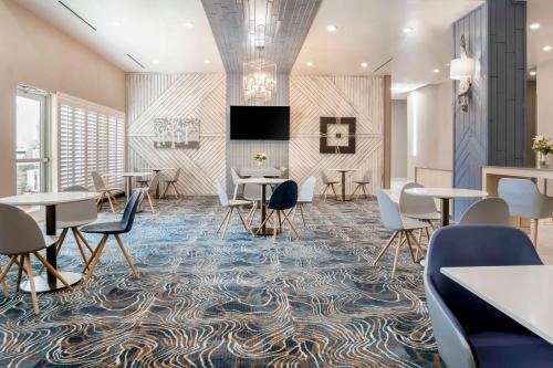 a conference room with tables and chairs on a rug at TownePlace Suites Amarillo West/Medical Center in Amarillo